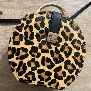 This is a cute, leopard print purse.  Purse has a strap that is adjustable